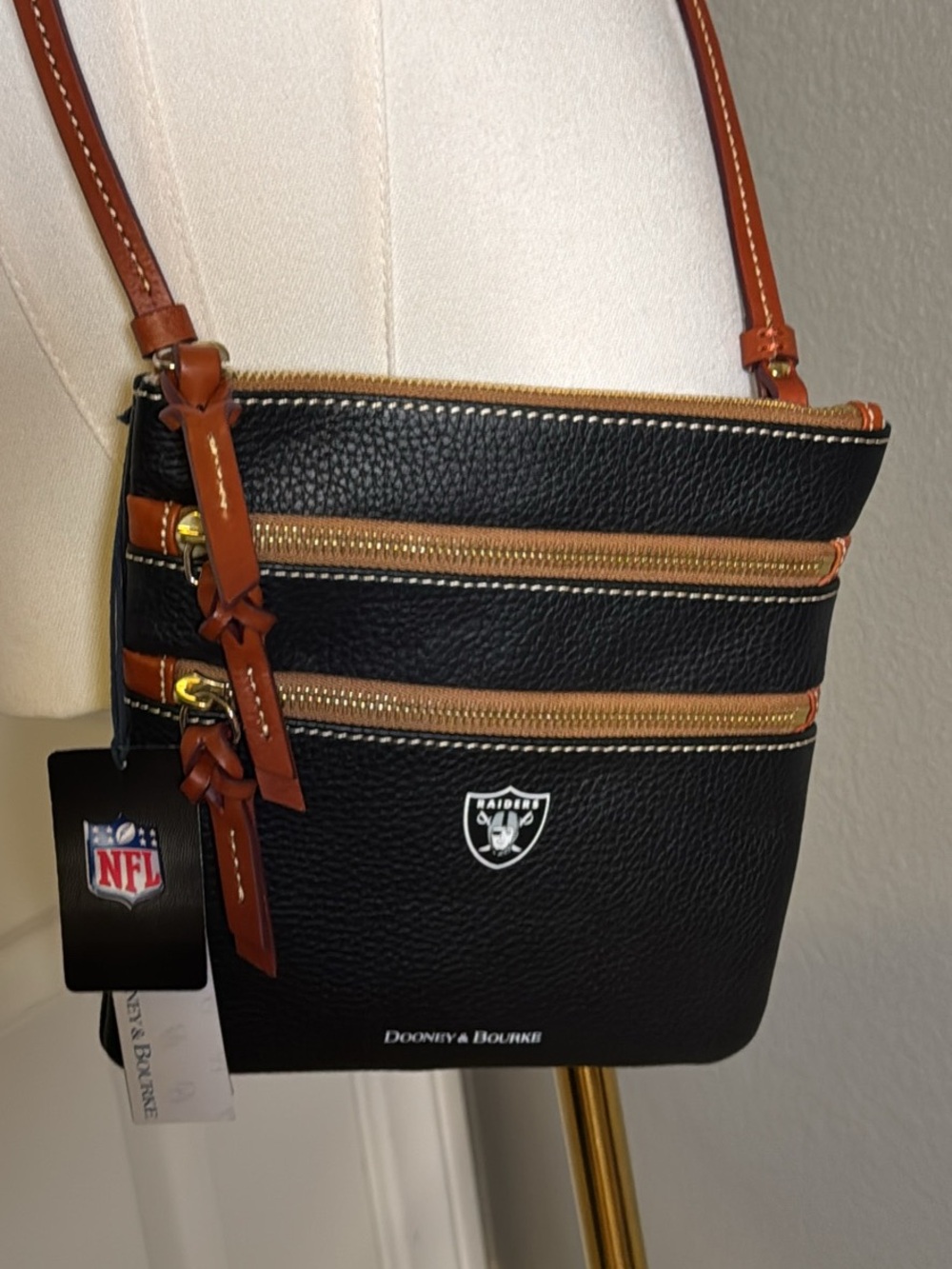 Dooney & Bourke Black Leather Raiders Crossbody with Brown Trim